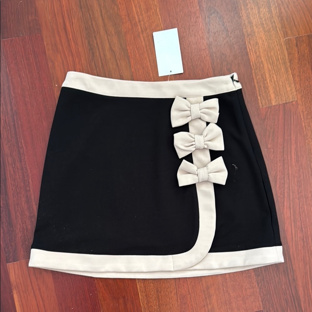 Elegant Black and Cream Skirt with Bow Accents